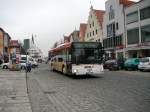 Busse/121755/ein-man-nl-223-mit-der Ein MAN NL 223 mit der Linie 561 auf der Obere Marktstrae (am 14.2.11) in Neumarkt ist auf dem weg zum Bahnhof


