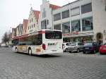 Busse/121757/ein-weisser-setra-bus-fuhr-mit Ein weier Setra Bus fuhr mit der Aufschrift: '570' am 14.2.11 in Neumarkt auf der Oberen Marktstrae vorbei